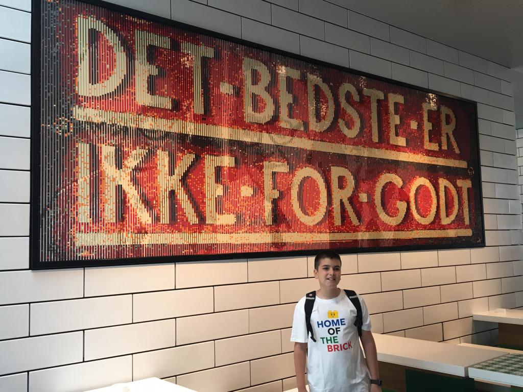 In front of Ole Kirk Kristiansen’s motto at LEGO House