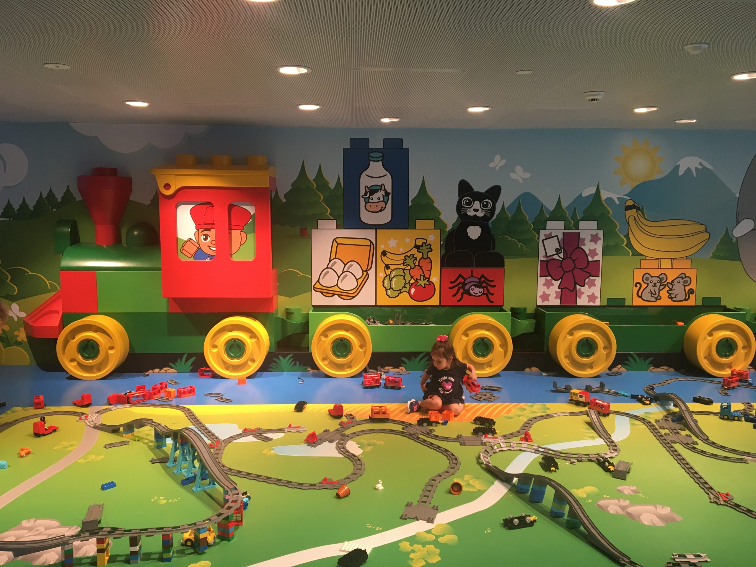 My sister playing at LEGO House in Billund in 2019